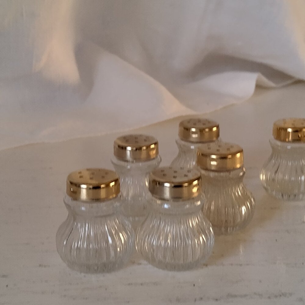 Salt & pepper shakers, individual size, glass with brass tops, perfect condition